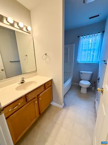 a bathroom with a sink double vanity and a mirror