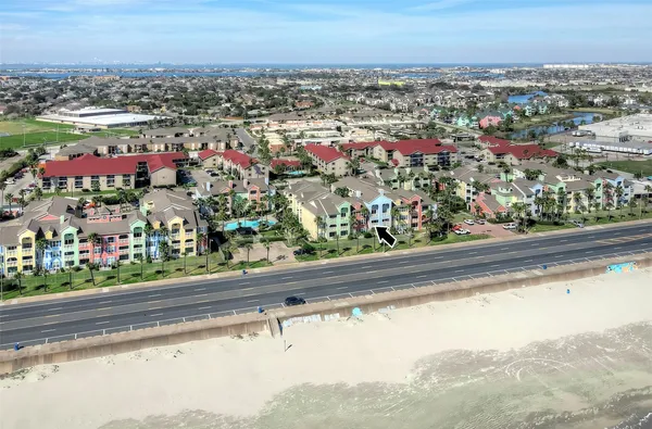 a living room with furniture a fireplace and a chandelier