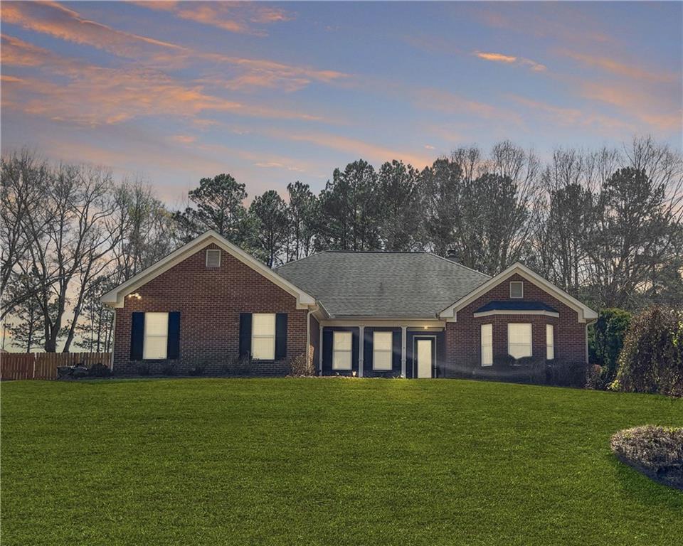 314 Arbor Rd S West Monroe, GA 30656 - Photo 1 of 1 a front view of a house with garden