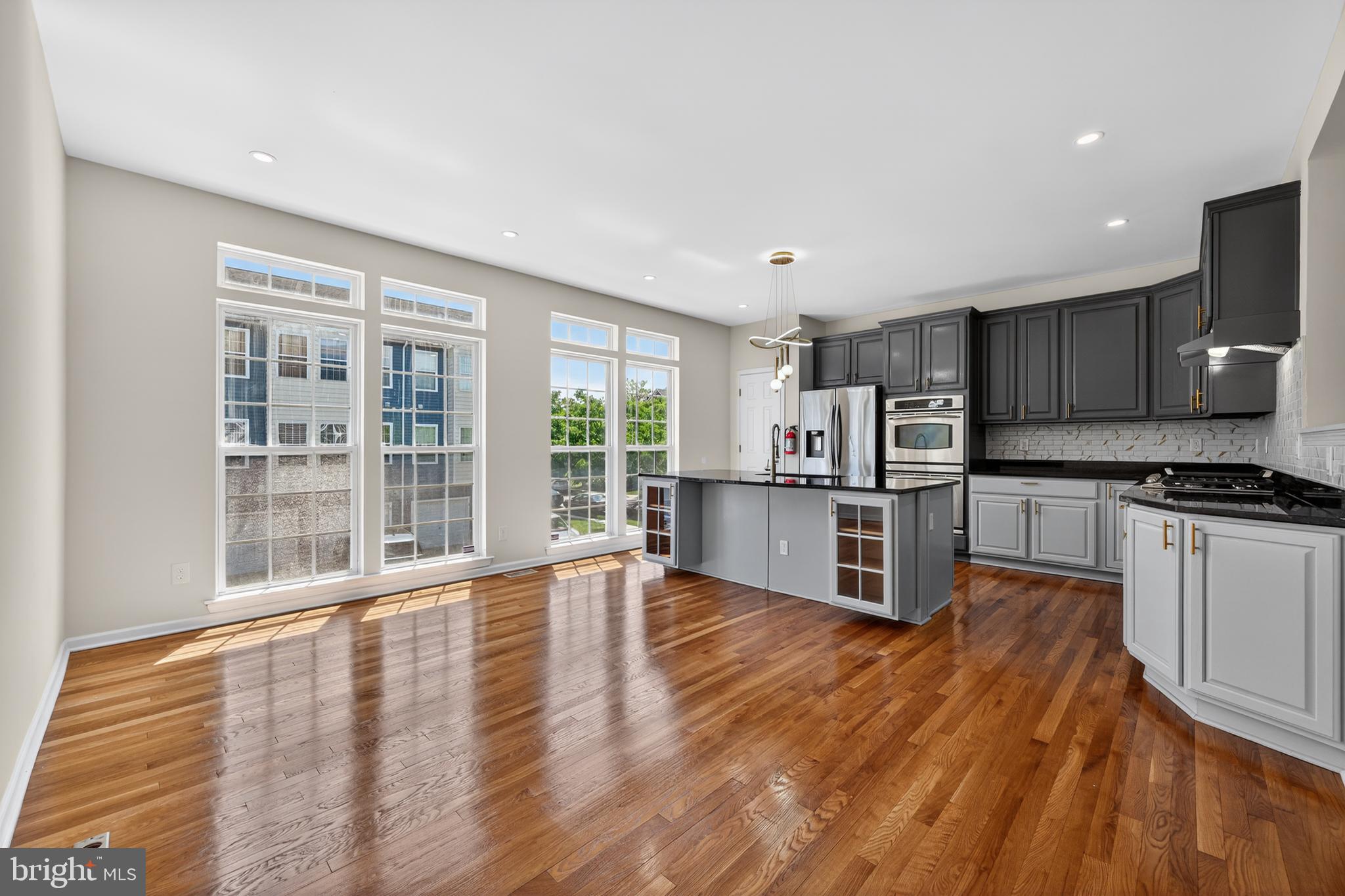 3 Swan Court Delran, NJ 08075 - Photo 16 of 34 a kitchen with stainless steel appliances wooden floors and large window