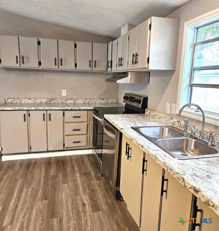 32 Briarwood Road Belton, TX 76513 - Photo 5 of 21 a kitchen with granite countertop a sink stove and cabinets