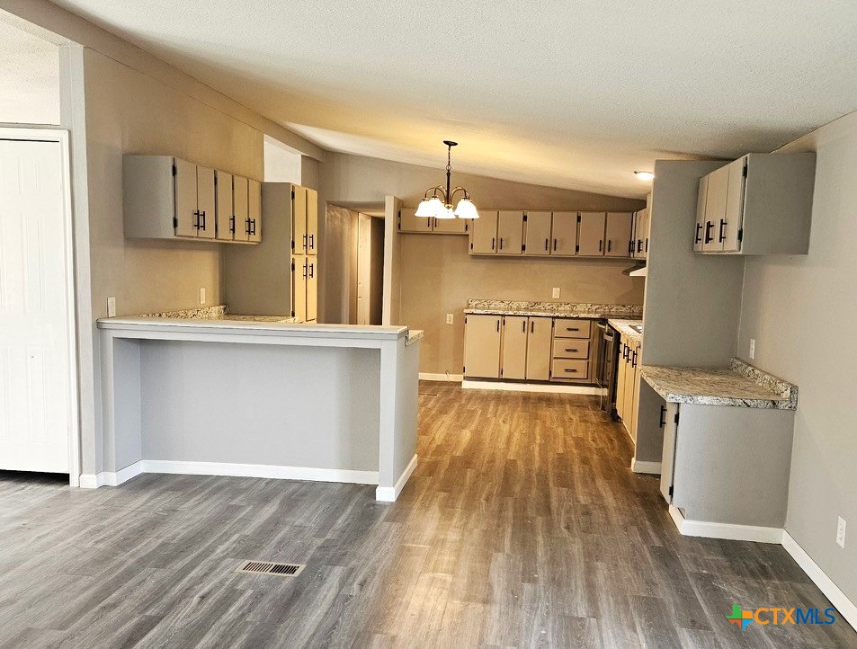 32 Briarwood Road Belton, TX 76513 - Photo 6 of 21 a view of a kitchen with wooden floor and electronic appliances