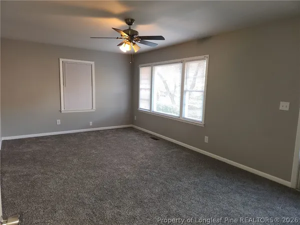 a view of an empty room with a window