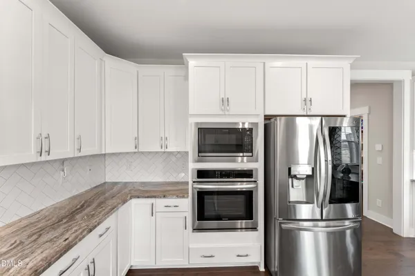 a view of washer and dryer with kitchen countertops