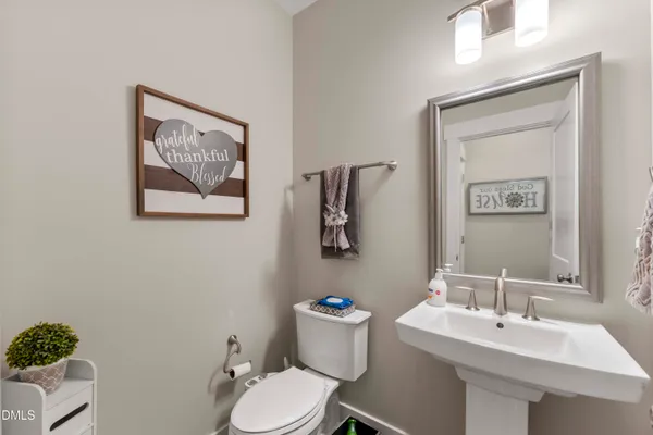 a spacious bedroom with a bed and a flat screen tv