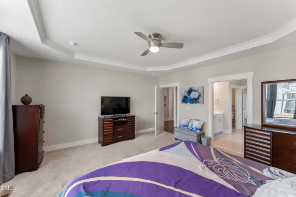 a view of a hallway with workspace and a window