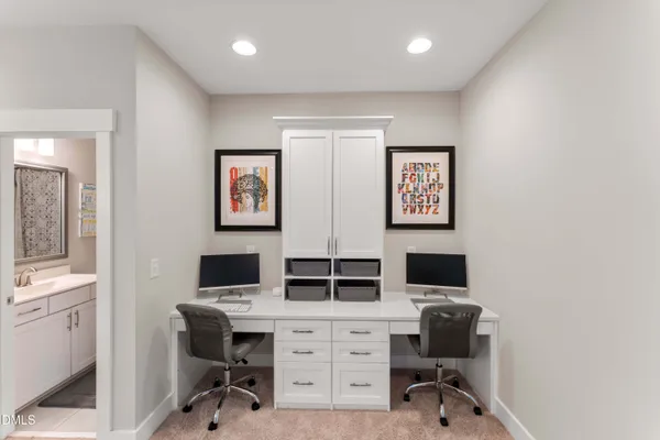 a bathroom with a sink a toilet and shower curtain