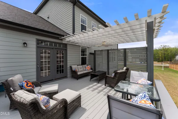 a view of a white house with a fountain in front of it