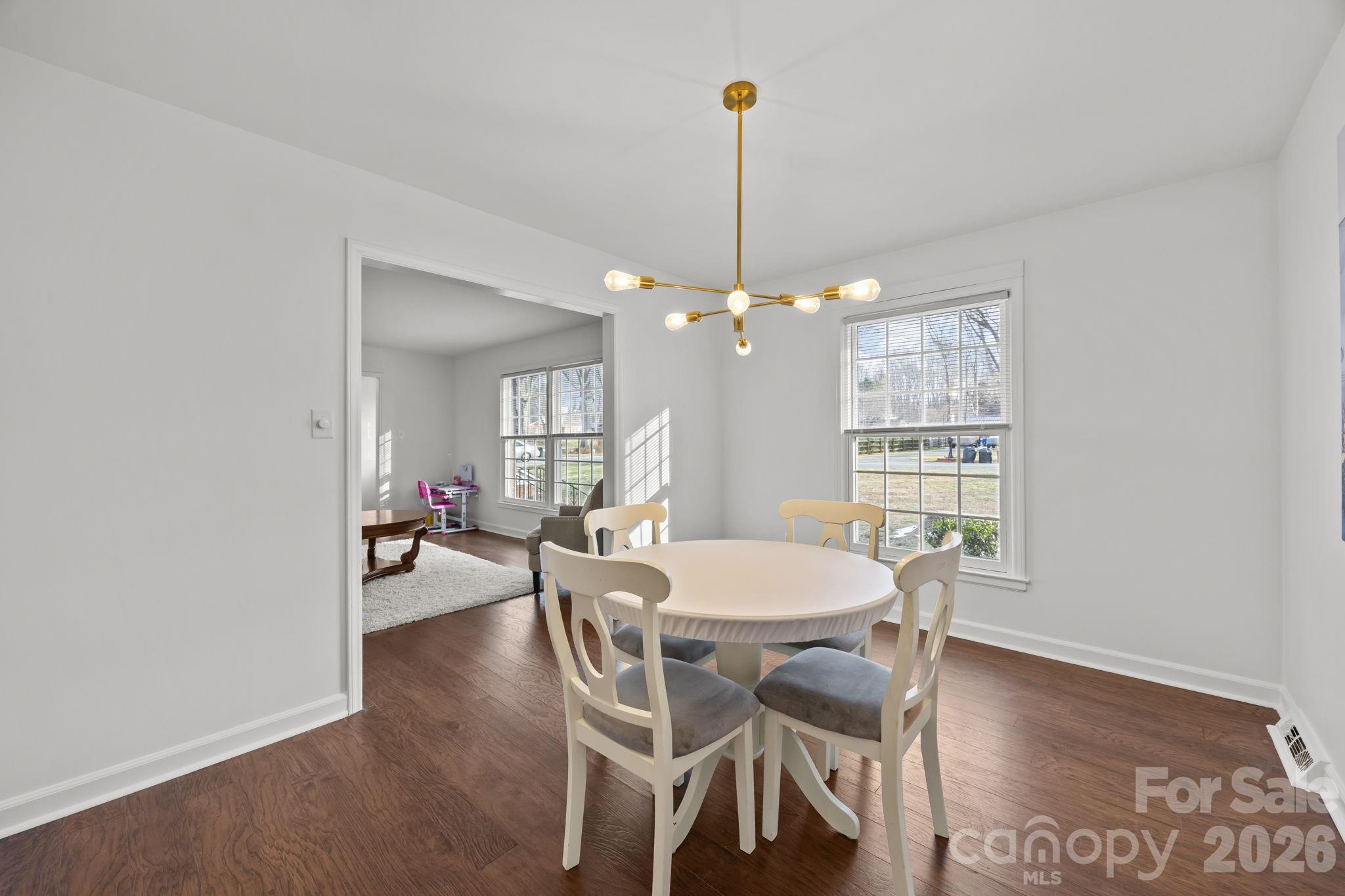 2431 Fox Hollow Road Mint Hill, NC 28227 - Photo 13 of 30 a view of a dining room with furniture window and wooden floor