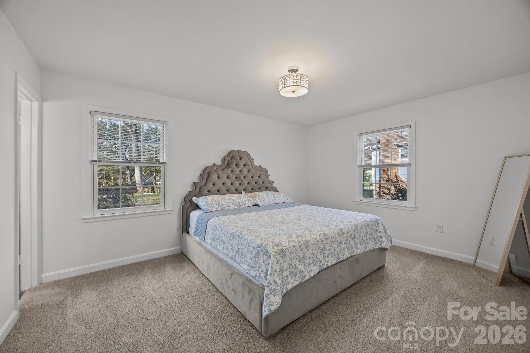 2431 Fox Hollow Road Mint Hill, NC 28227 - Photo 16 of 30 a bedroom with a bed and a window