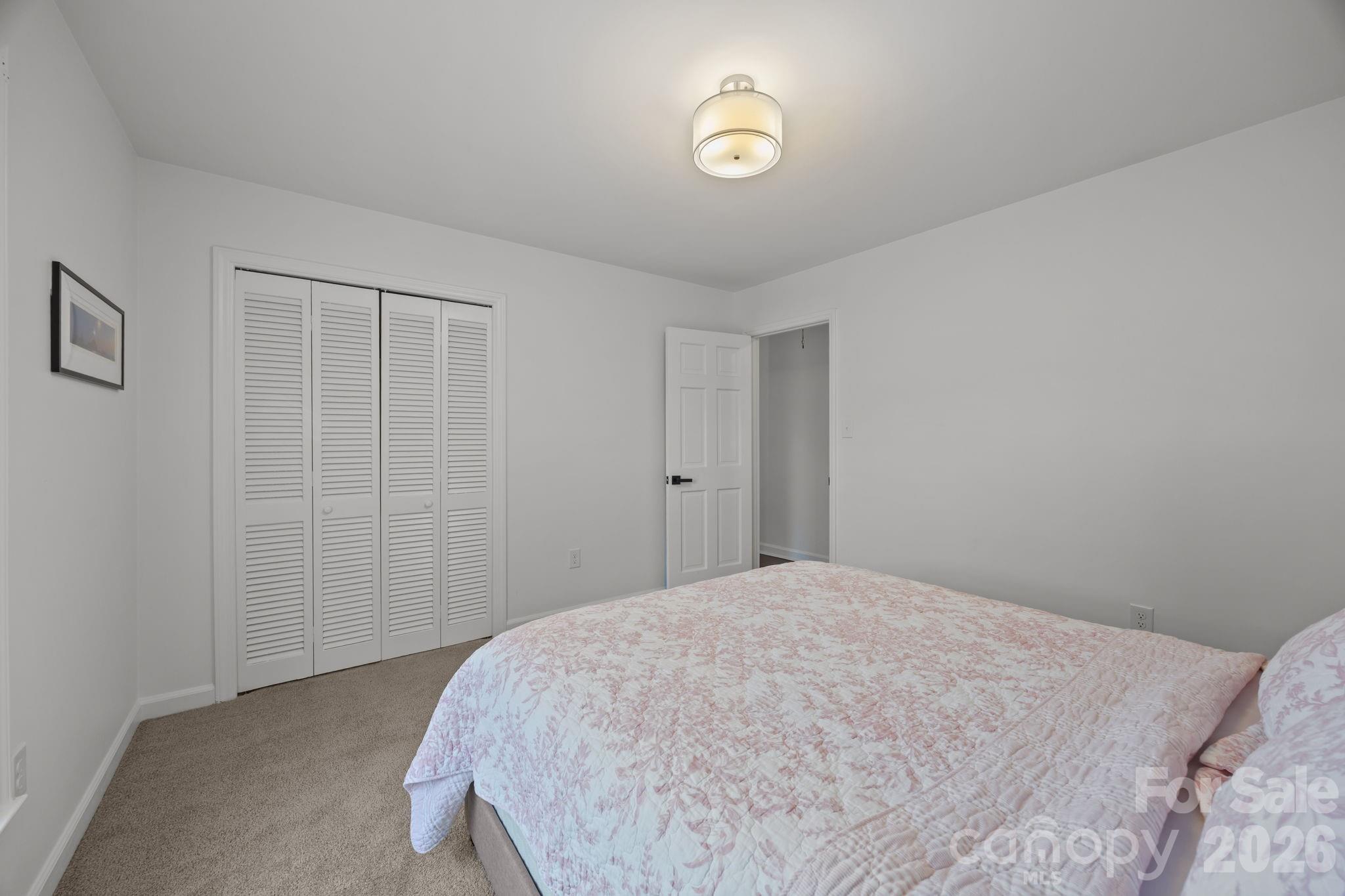 2431 Fox Hollow Road Mint Hill, NC 28227 - Photo 19 of 30 a bedroom with a bed and a window