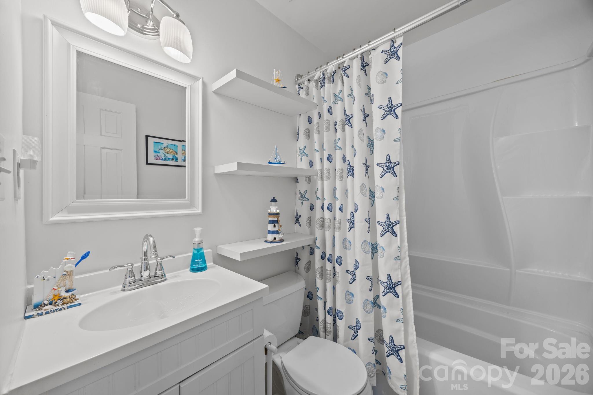 2431 Fox Hollow Road Mint Hill, NC 28227 - Photo 20 of 30 a bathroom with a sink a toilet and shower