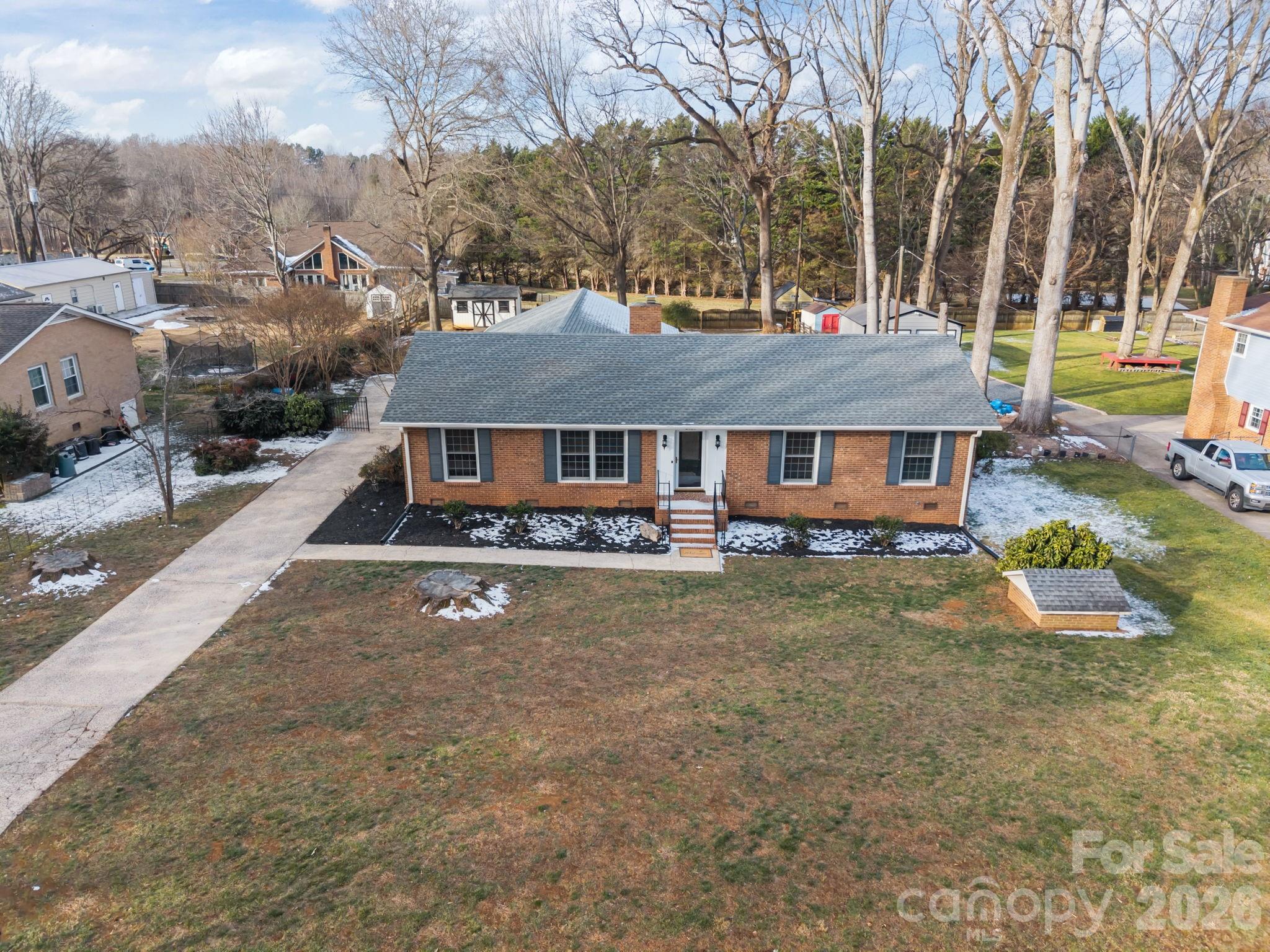 2431 Fox Hollow Road Mint Hill, NC 28227 - Photo 26 of 30 an aerial view of a house with swimming pool