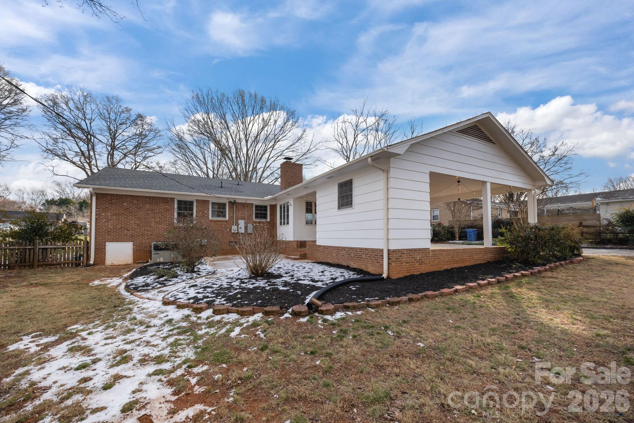 2431 Fox Hollow Road Mint Hill, NC 28227 - Photo 28 of 30 a view of a house with a bed and a yard