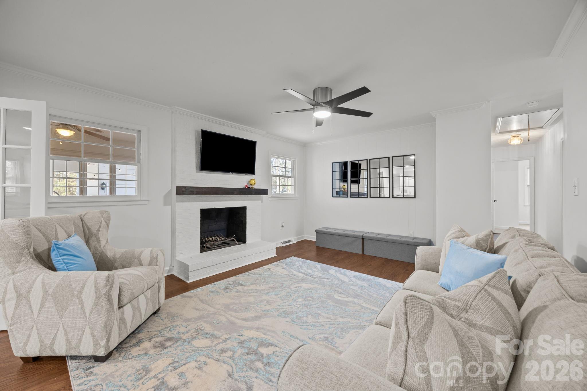 2431 Fox Hollow Road Mint Hill, NC 28227 - Photo 5 of 30 a bed room with a bed couches and a flat screen tv