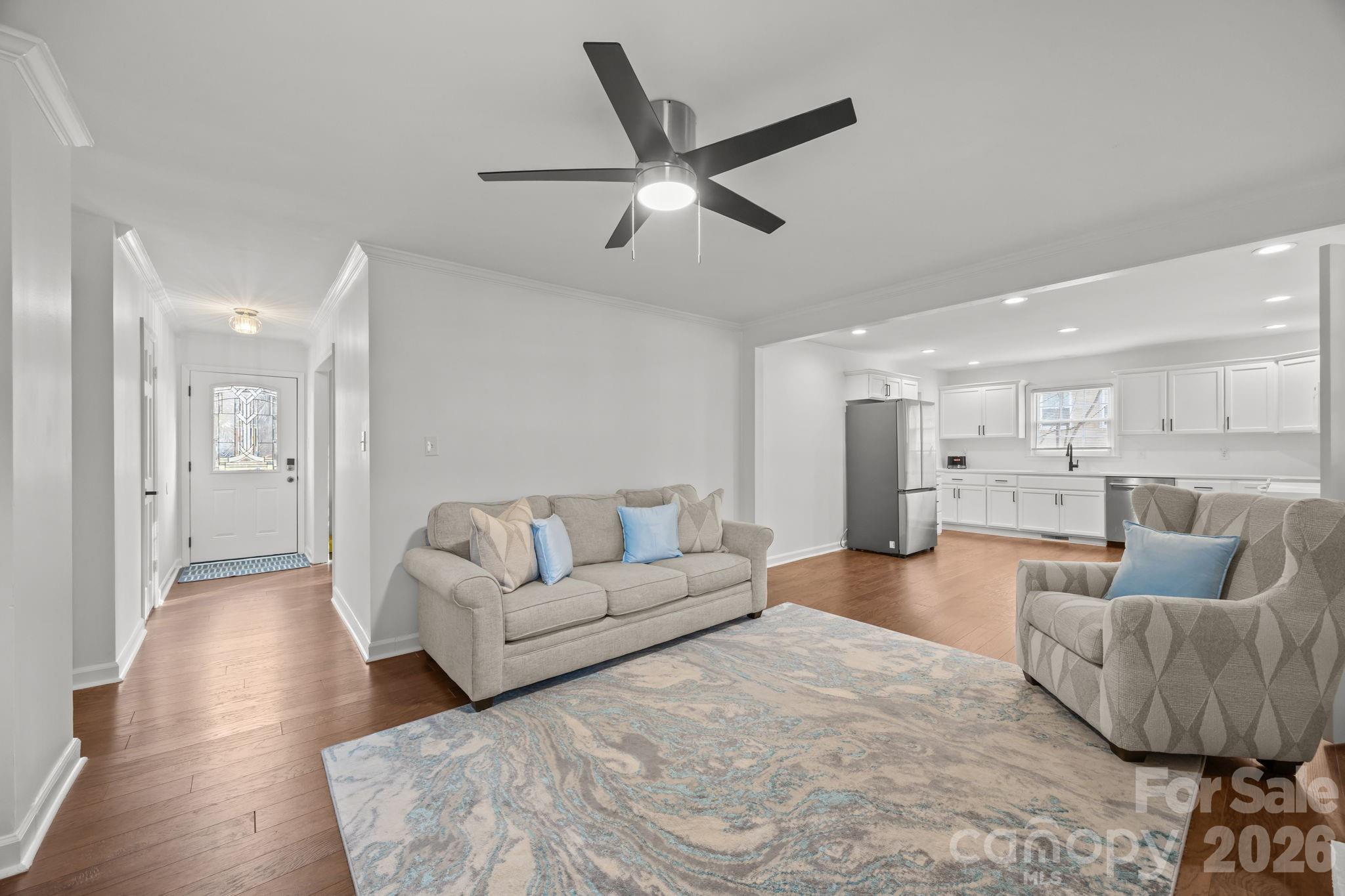 2431 Fox Hollow Road Mint Hill, NC 28227 - Photo 6 of 30 a living room with furniture and a view of kitchen