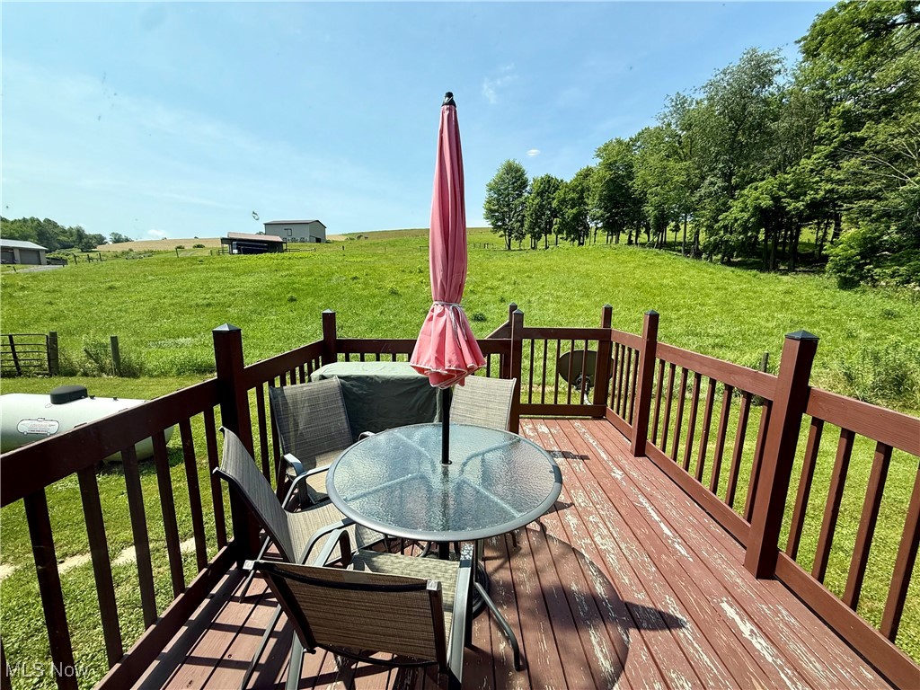 2306 Gordon Road Northwest Dover, OH 44622 - Photo 25 of 26 Wooden terrace with a yard and outdoor dining space