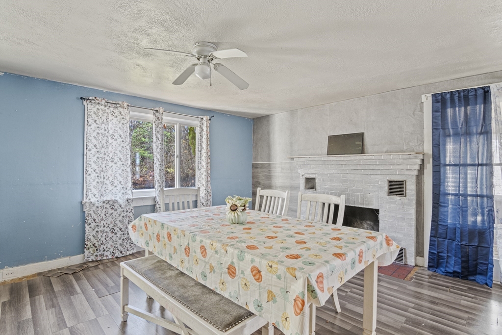 15 White Street Lunenburg, MA 01462 - Photo 17 of 29 a bedroom with a bed and a fireplace