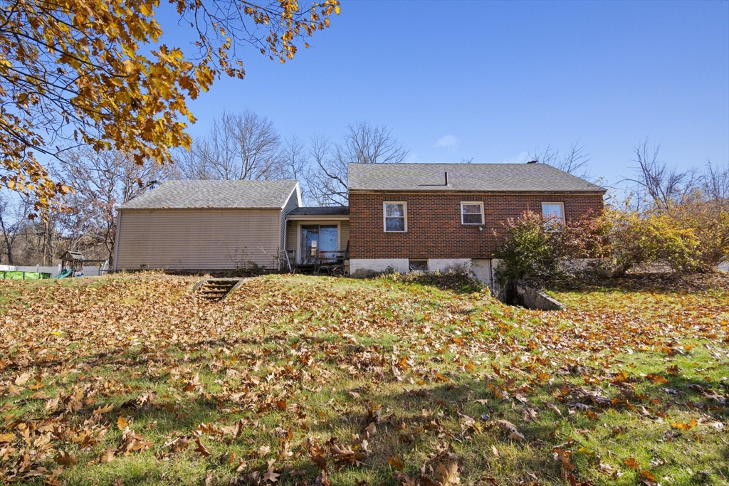 15 White Street Lunenburg, MA 01462 - Photo 25 of 29 a front view of a house with a yard
