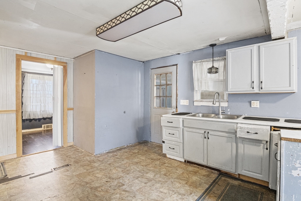 15 White Street Lunenburg, MA 01462 - Photo 7 of 29 a kitchen with sink cabinets and window