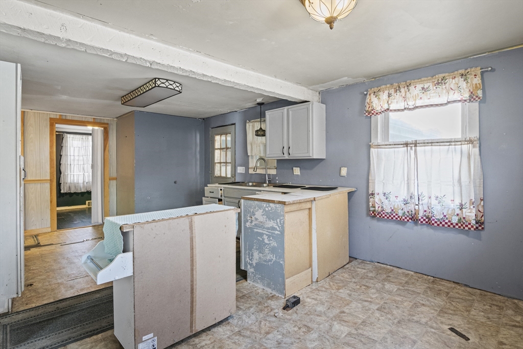 15 White Street Lunenburg, MA 01462 - Photo 9 of 29 a kitchen with cabinets and window