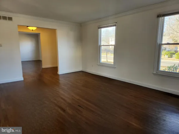 a view of a livingroom with wooden floor
