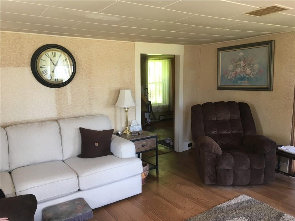 411 Ellis River Road Rumford, ME 04276 - Photo 15 of 26 Over sized living room with faux...
