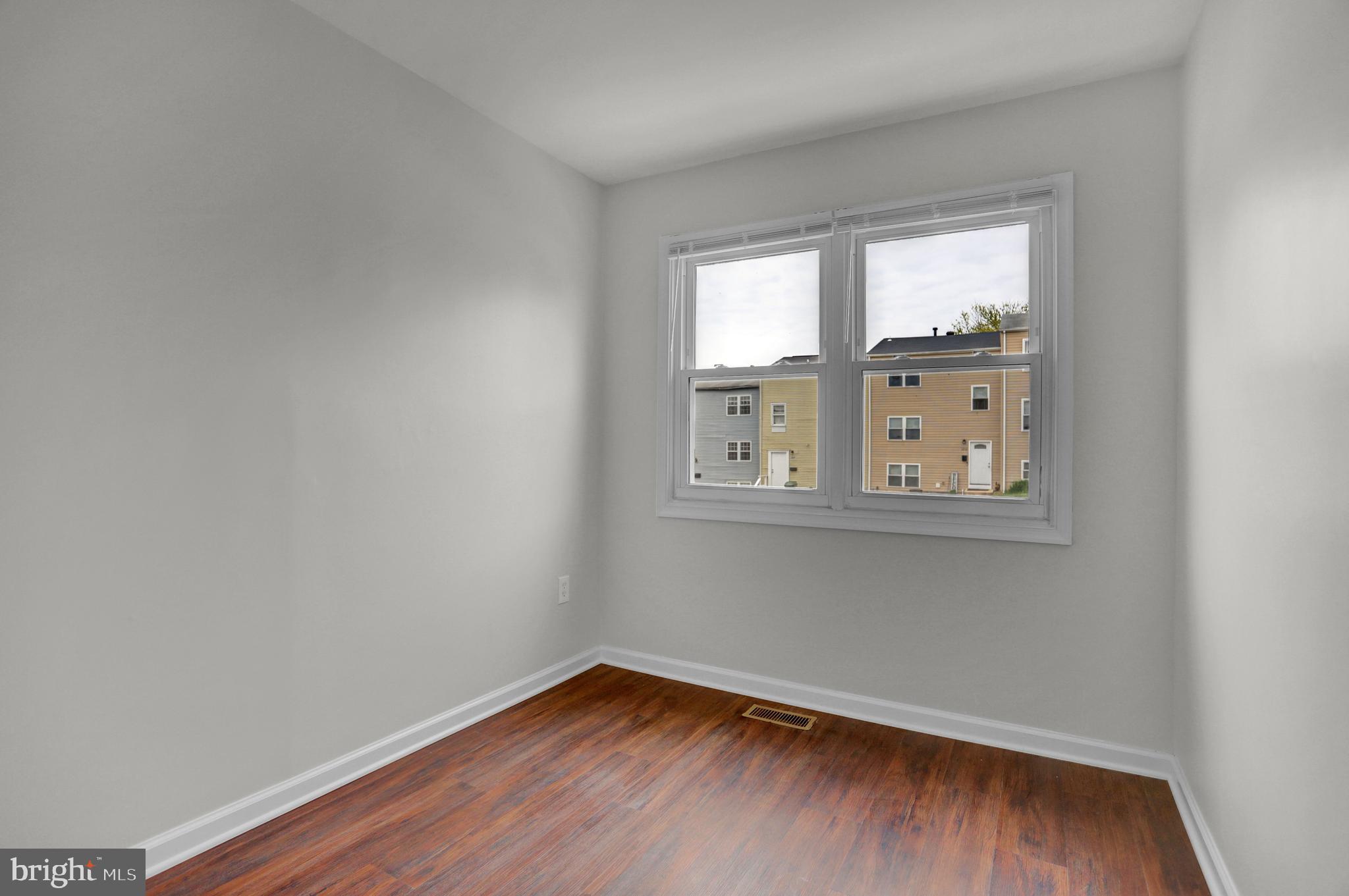 1885 Brookside Drive Edgewood, MD 21040 - Photo 17 of 45 wooden floor in an empty room with a window