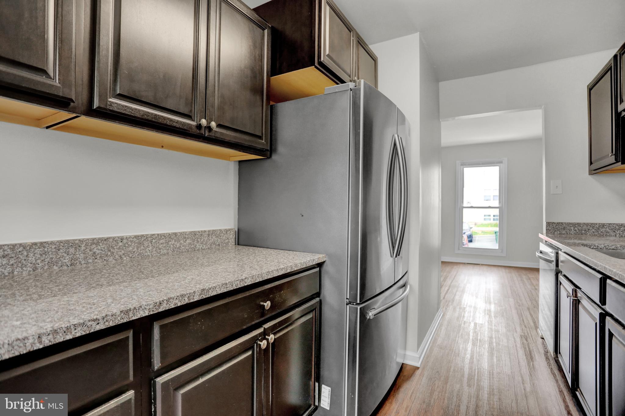 1885 Brookside Drive Edgewood, MD 21040 - Photo 22 of 45 a kitchen with stainless steel appliances granite countertop a stove a refrigerator and wooden floor