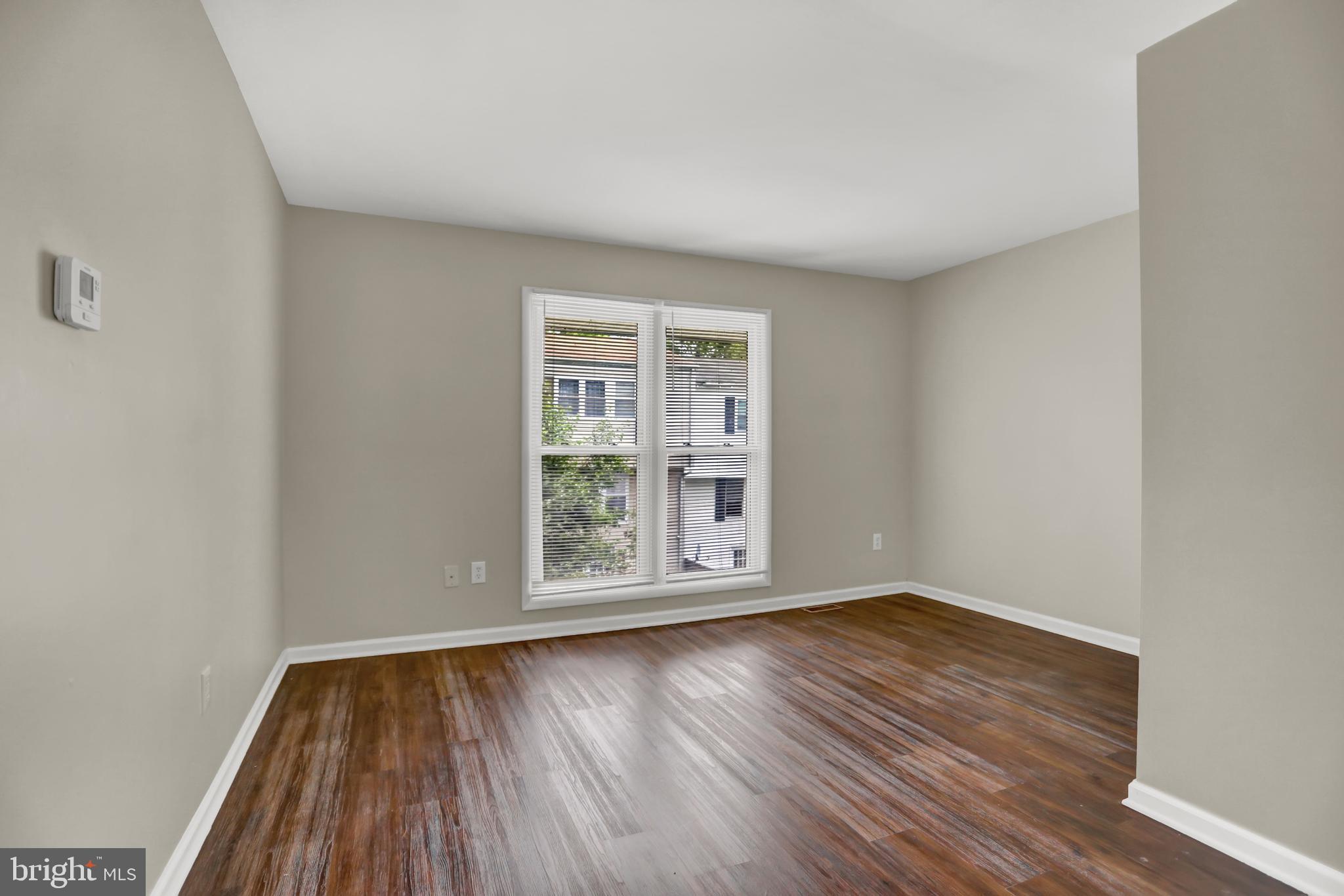 1885 Brookside Drive Edgewood, MD 21040 - Photo 24 of 45 an empty room with wooden floor and windows