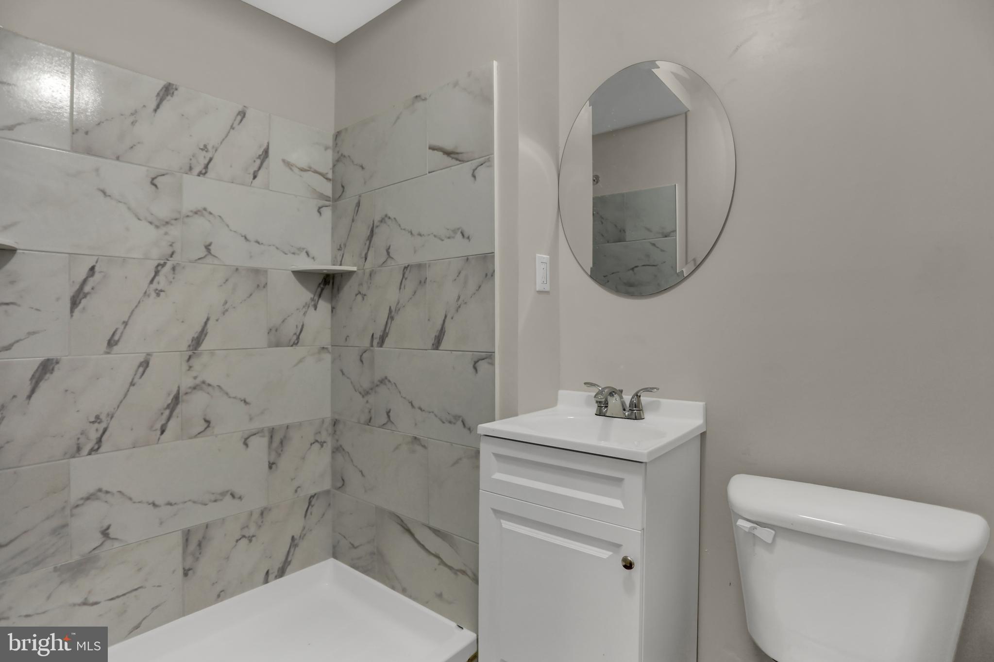 1885 Brookside Drive Edgewood, MD 21040 - Photo 34 of 45 a bathroom with a toilet sink vanity and mirror