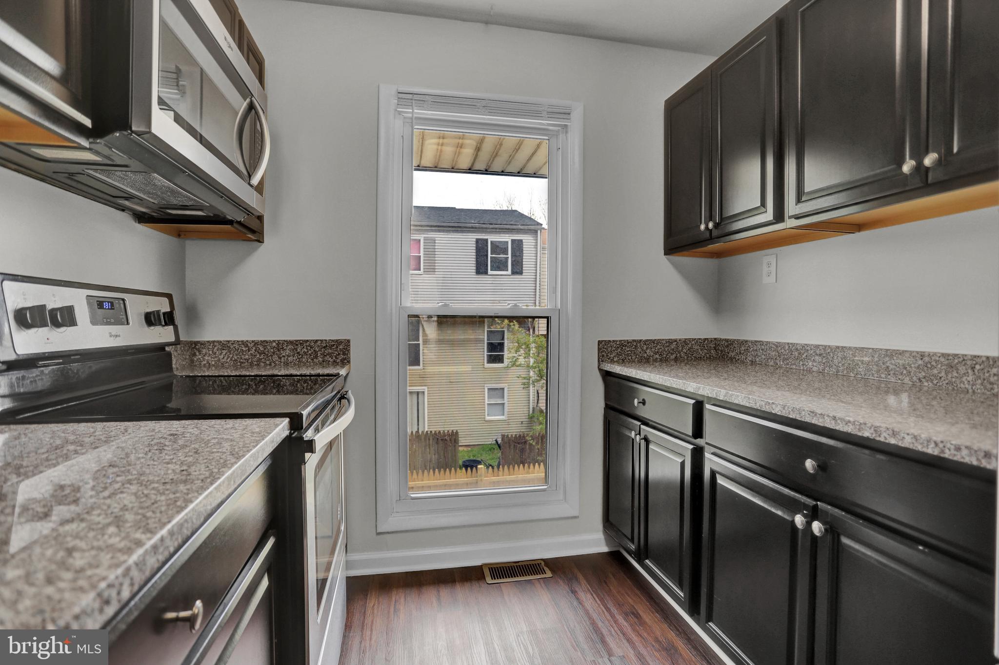 1885 Brookside Drive Edgewood, MD 21040 - Photo 4 of 45 a kitchen with stainless steel appliances granite countertop a stove and a microwave