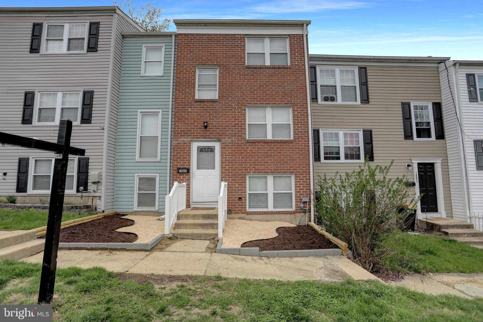 1885 Brookside Drive Edgewood, MD 21040 - Photo 41 of 45 a view of a brick house with many windows and a yard
