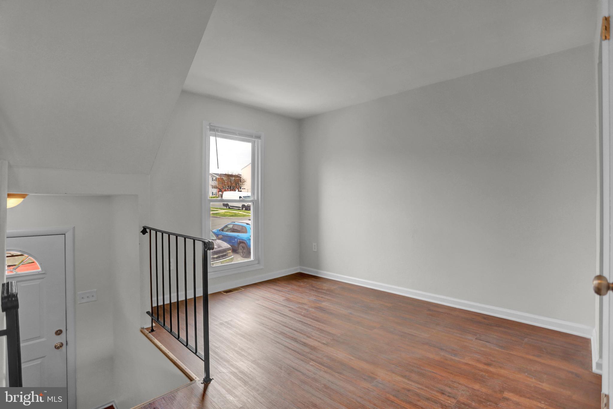 1885 Brookside Drive Edgewood, MD 21040 - Photo 6 of 45 an empty room with wooden floor and windows