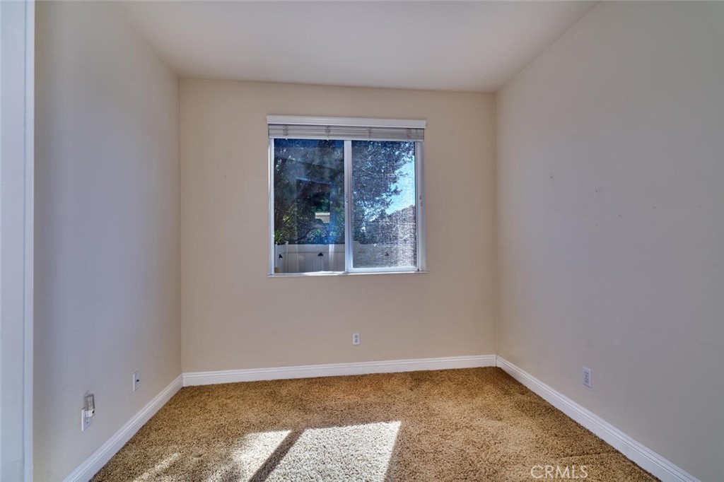 1143 Saguara Road Beaumont, CA 92223 - Photo 44 of 66 a view of an empty room with a window