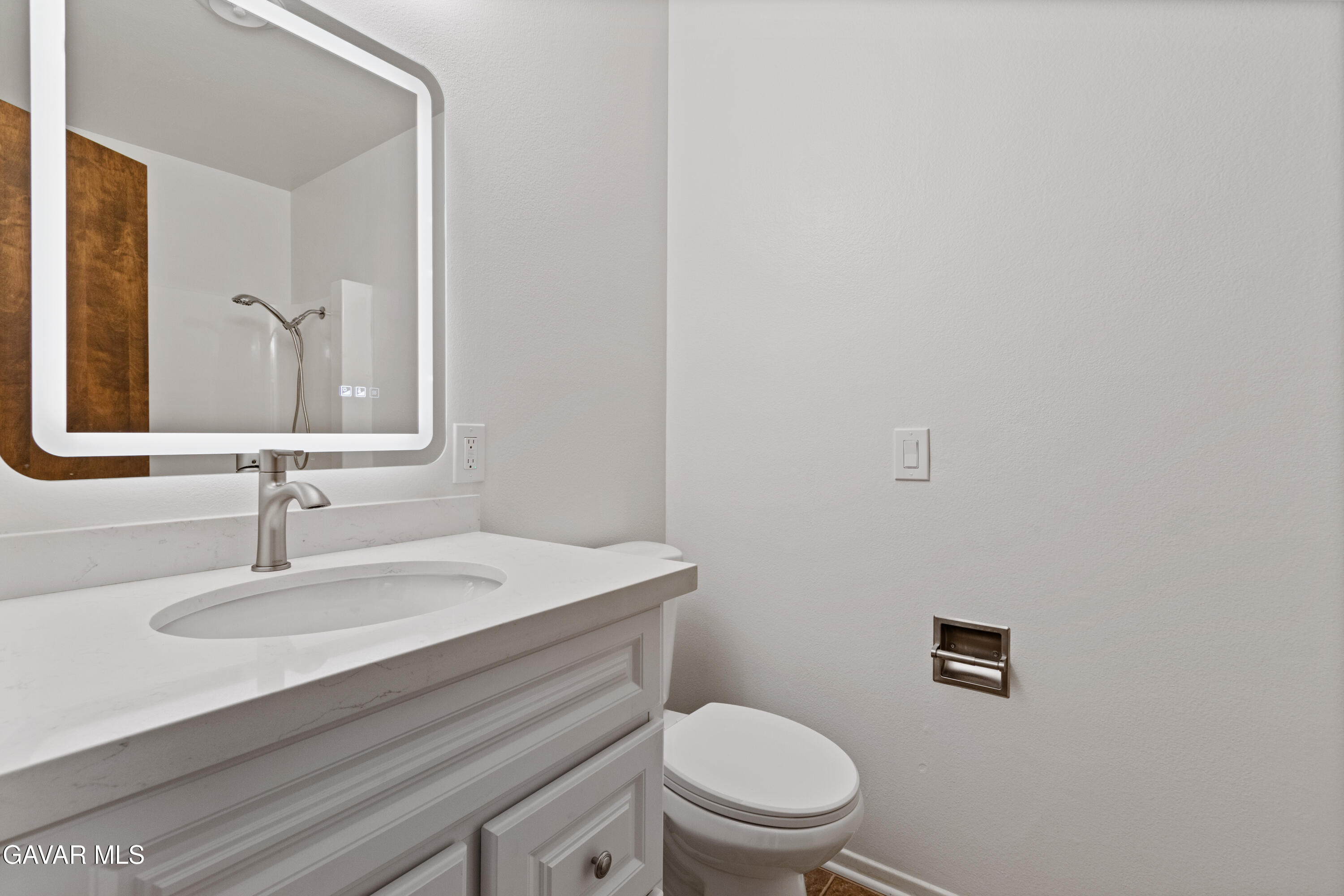 42520 55th Street West Lancaster, CA 93536 - Photo 15 of 21 a bathroom with a sink a toilet and a mirror