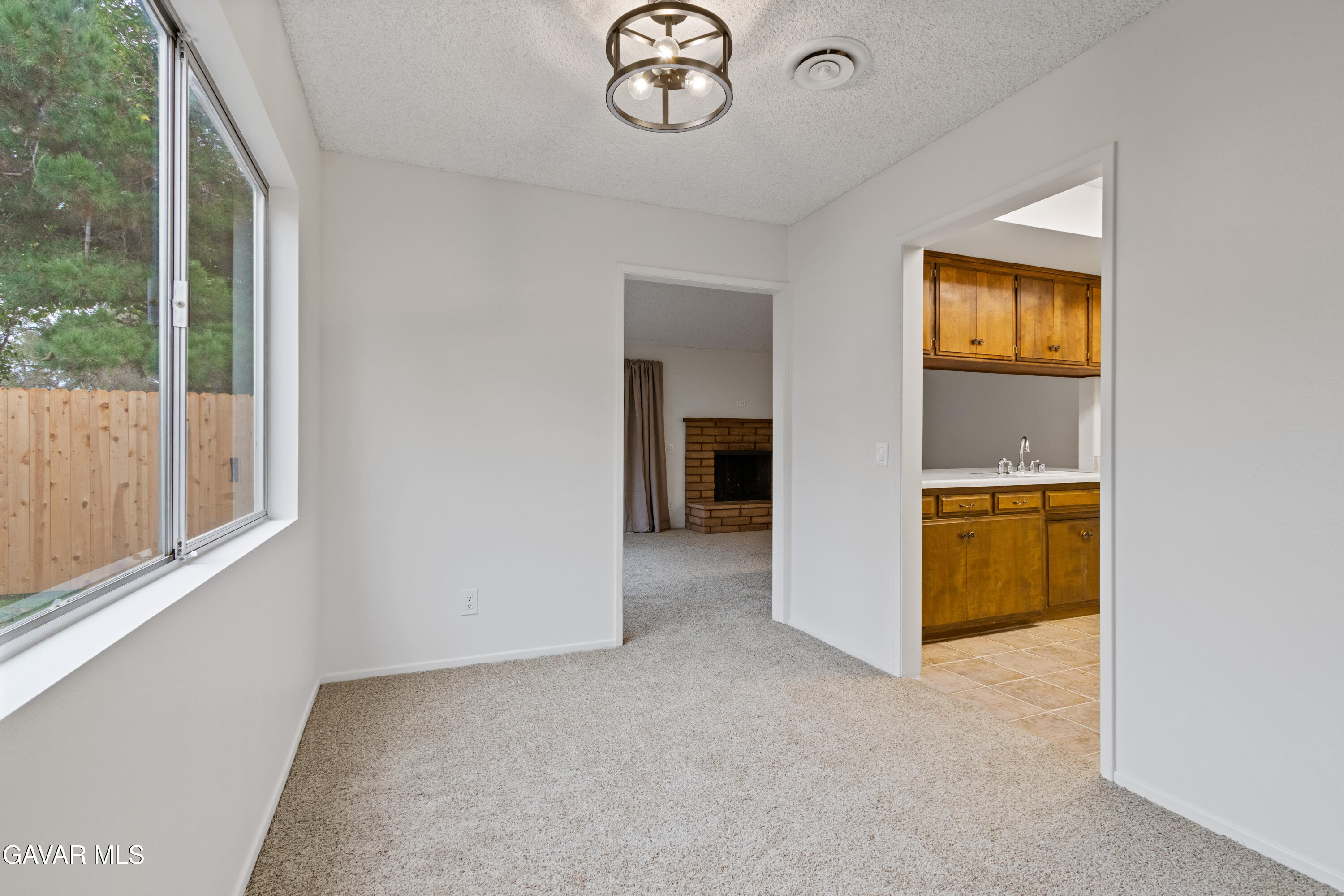 42520 55th Street West Lancaster, CA 93536 - Photo 4 of 21 a view of an empty room with a window