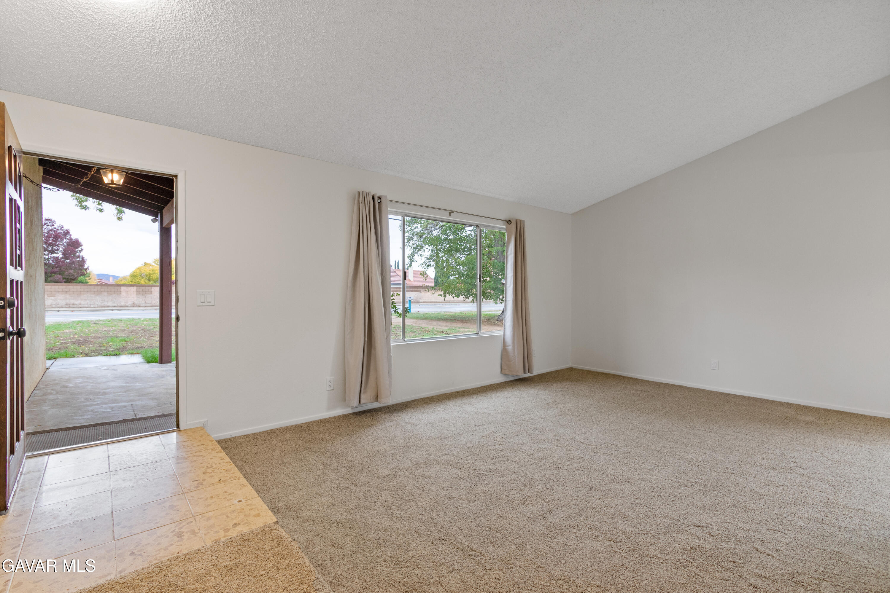 42520 55th Street West Lancaster, CA 93536 - Photo 6 of 21 a view of an empty room and window