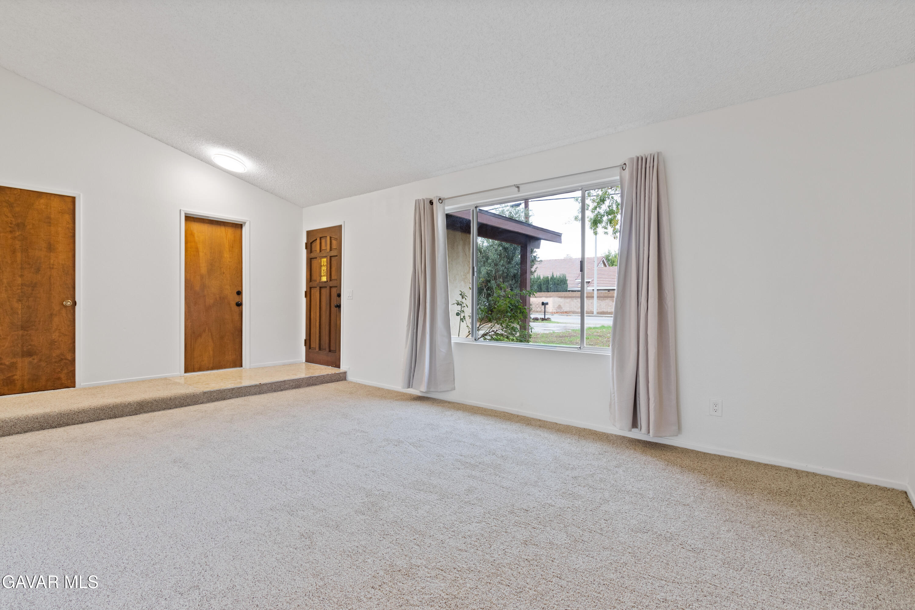 42520 55th Street West Lancaster, CA 93536 - Photo 7 of 21 a view of an empty room with a window