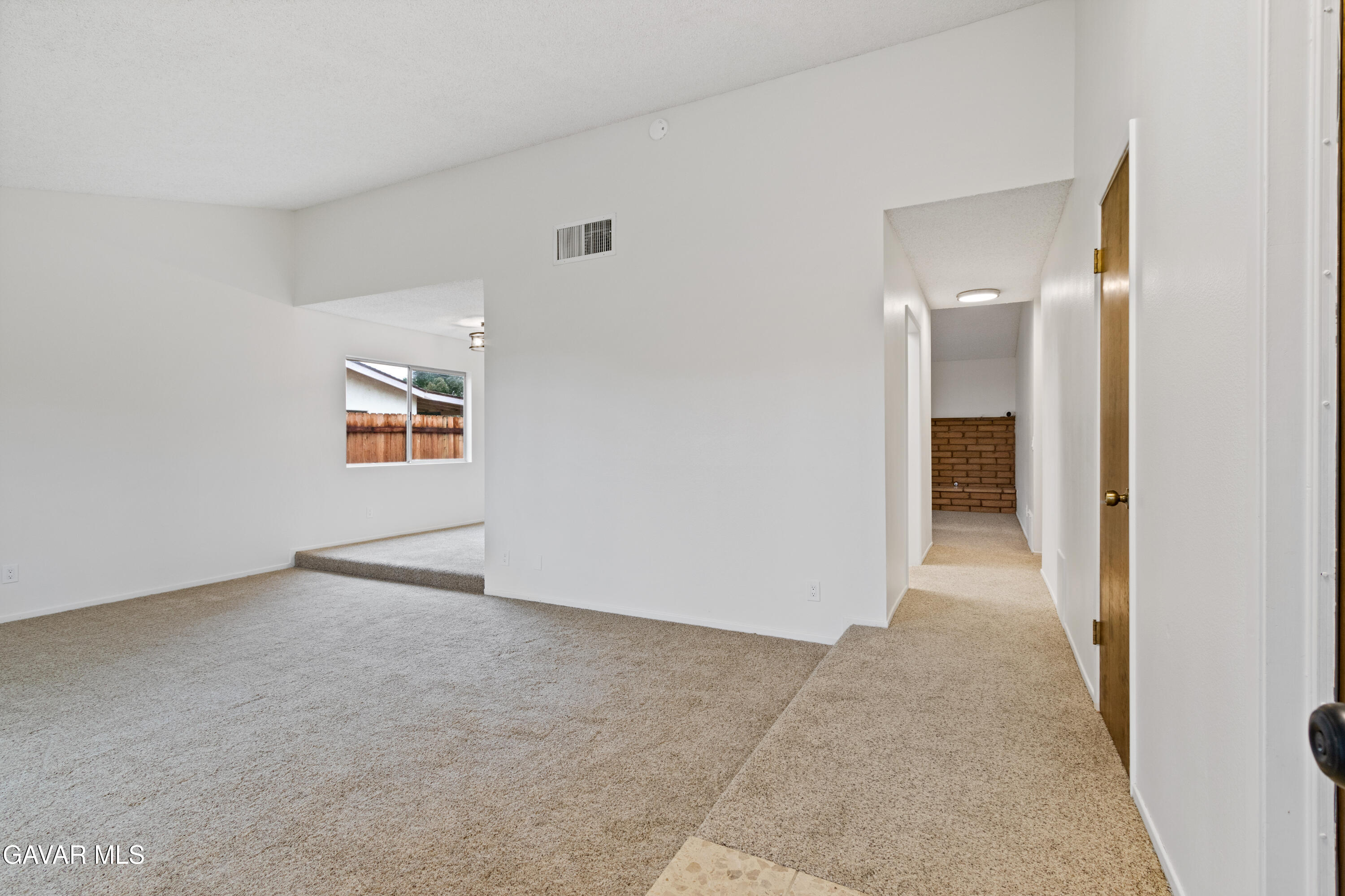 42520 55th Street West Lancaster, CA 93536 - Photo 8 of 21 an empty room with windows and entrance