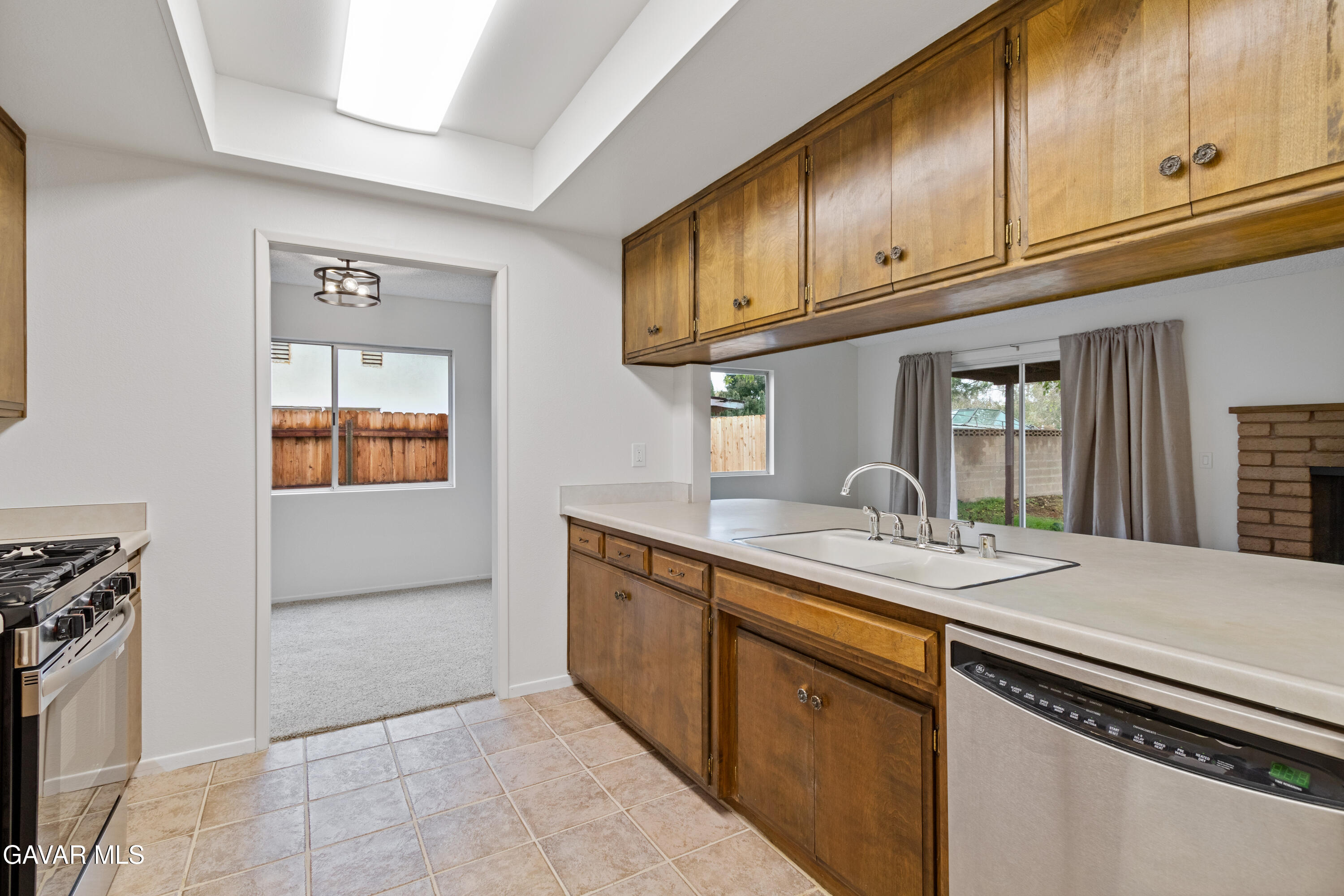 42520 55th Street West Lancaster, CA 93536 - Photo 9 of 21 a kitchen with stainless steel appliances granite countertop a sink and cabinets