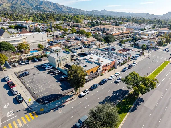 an aerial view of a city with streets and houses
