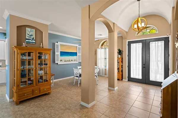 a spacious bathroom with a granite countertop sink a mirror and a bathtub