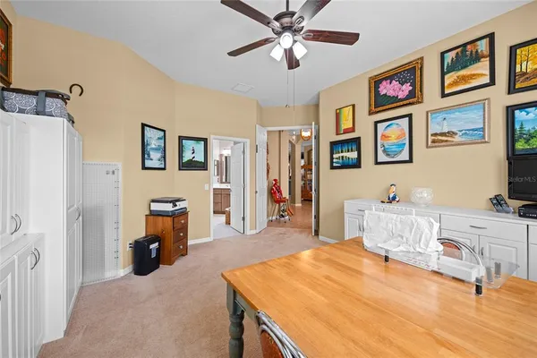 a kitchen with kitchen island granite countertop a sink counter top space appliances and cabinets