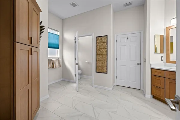 a kitchen with a sink counter top space and stainless steel appliances