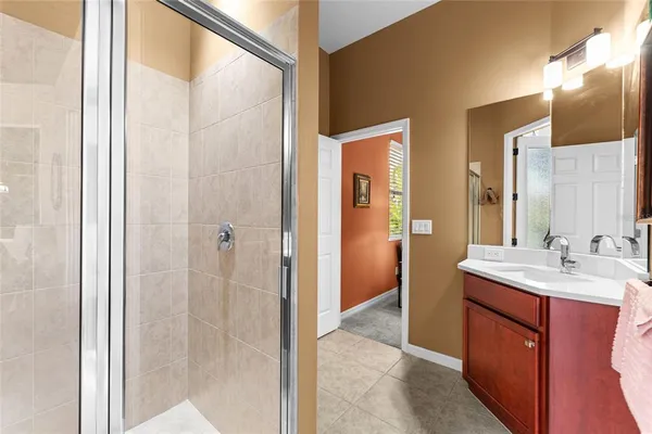 a spacious bedroom with a bed and a window