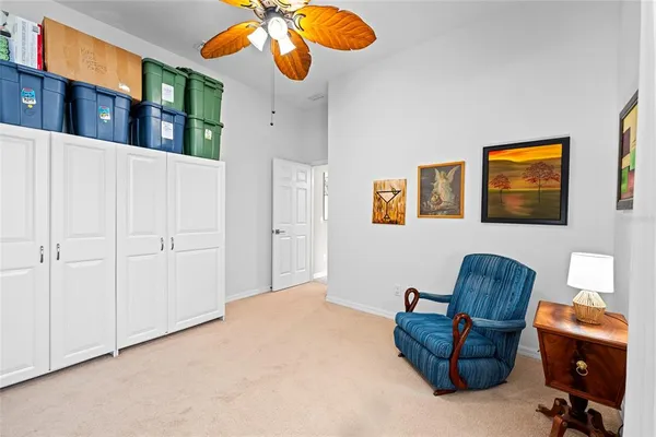 a view of a swimming pool with a sitting area