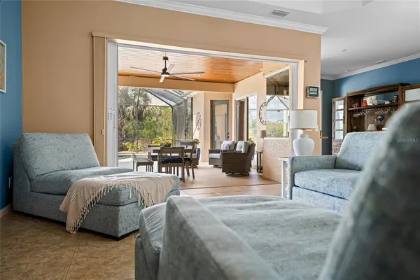a view of a swimming pool with a patio and a yard