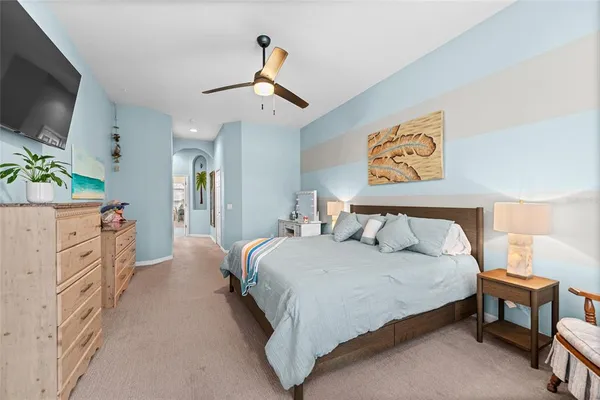 a front view of a house with garden and sitting area