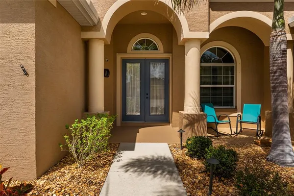 a view of a livingroom with furniture and a flat screen tv